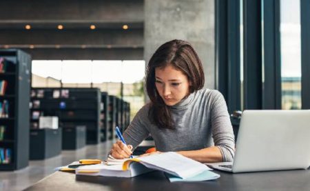 Woman studying in library